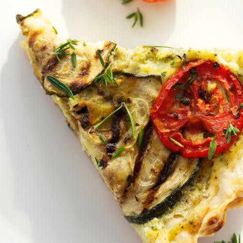 Savoury Zucchini Tart, zucchini tart recipe, easy savory tart, crispy crust, delicious zucchini dish, flavorful ingredients, mouthwatering flavors, culinary delight, easy recipe, visually appealing tart