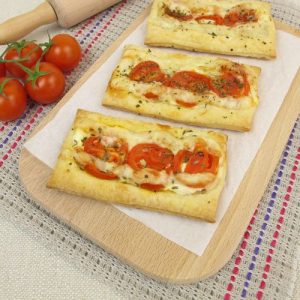 puff pastry breakfast, gourmet breakfast recipe, flaky puff pastry, creamy fillings, savory ingredients, fluffy eggs, melty cheese, crispy bacon, fresh vegetables, customizable breakfast, aromatic herbs, visually stunning, breakfast masterpiece.