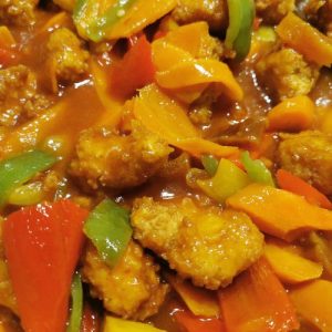 sweet and sour chicken, flavorful recipe, crispy batter, tangy sauce, homemade, crowd-pleaser, fusion cuisine, mouthwatering flavors