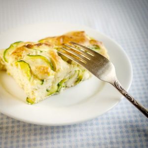 zucchini marrow tart, luscious zucchini tart, flavorful zucchini marrow recipe, buttery crust, exquisite blend of flavors, culinary masterpiece, visually stunning tart, aromatic zucchini tart, easy-to-make recipe, delightful fusion of flavors